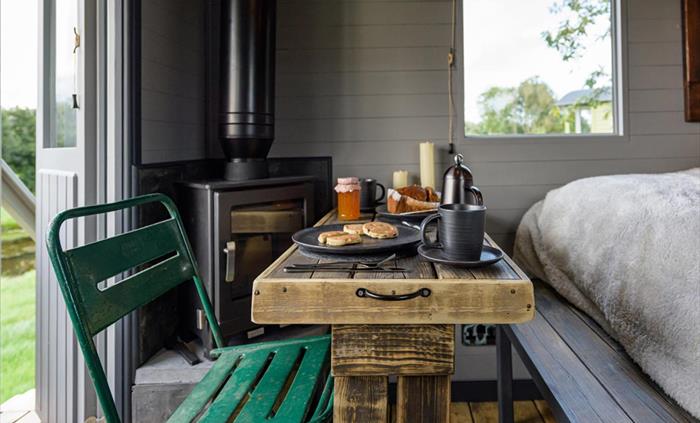 Cosy dining - Elen - Brook Cottage Shepherd Huts